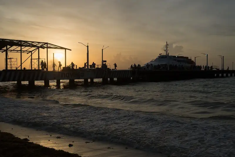 Cozumel ferry seen from Playa del Carmen at sunrise